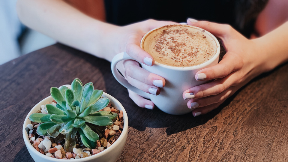 Woman drinking a latte